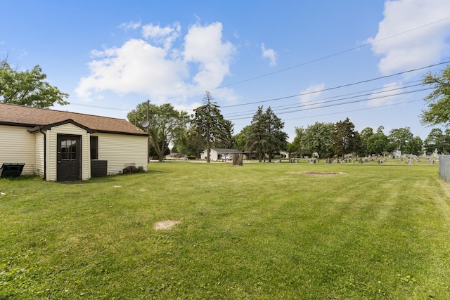 510 S Sycamore St, Genoa, IL 60135 - view of grassy yard featuring central AC unit