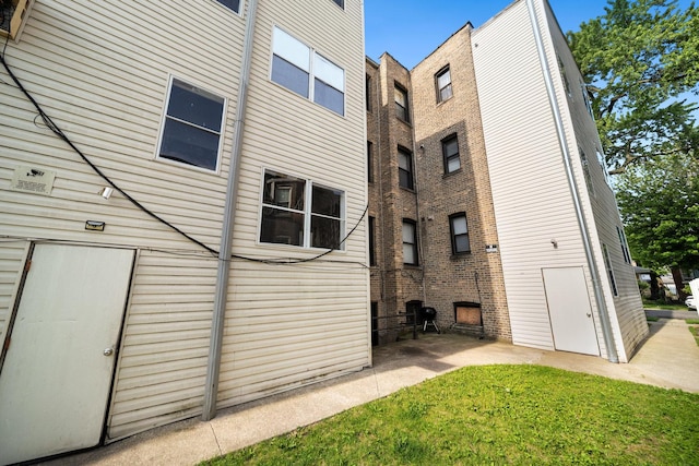 4054 W Palmer St Unit 2, Chicago, IL 60639 - rear view of property with a patio area and a yard