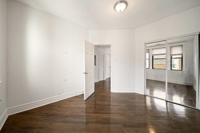 4054 W Palmer St Unit 2, Chicago, IL 60639 - unfurnished bedroom featuring wood finished floors, a closet, and baseboards