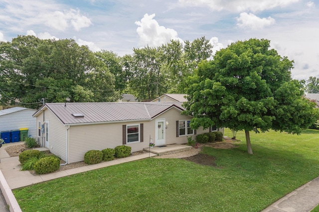 103 S Benson St, Lexington, IL 61753 - view of front of home with a front yard and a metal roof