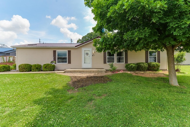 103 S Benson St, Lexington, IL 61753 - ranch-style house with a front lawn and a metal roof