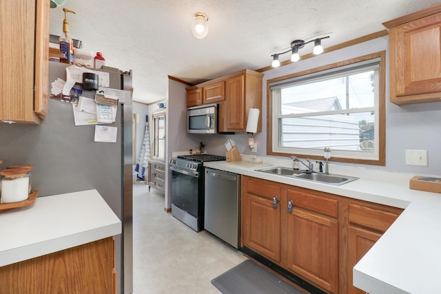 103 S Benson St, Lexington, IL 61753 - kitchen featuring appliances with stainless steel finishes, light countertops, light floors, and brown cabinets