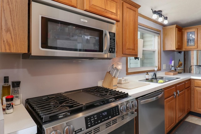 103 S Benson St, Lexington, IL 61753 - kitchen featuring appliances with stainless steel finishes, light countertops, and brown cabinetry