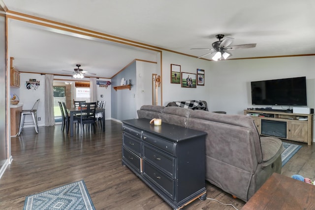 103 S Benson St, Lexington, IL 61753 - living area featuring ceiling fan, crown molding, and dark wood-style floors