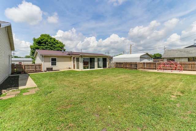 103 S Benson St, Lexington, IL 61753 - back of house featuring a fenced backyard, a metal roof, and a playground