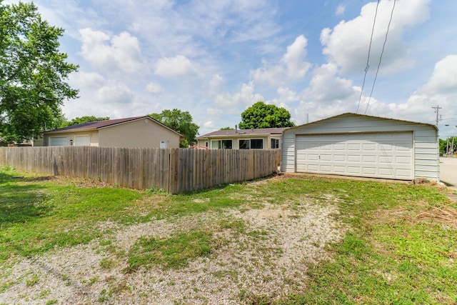 103 S Benson St, Lexington, IL 61753 - view of yard featuring a garage and an outbuilding