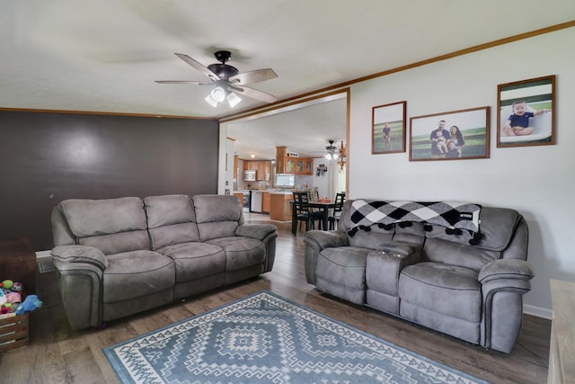 103 S Benson St, Lexington, IL 61753 - living area featuring ceiling fan, wood finished floors, and ornamental molding