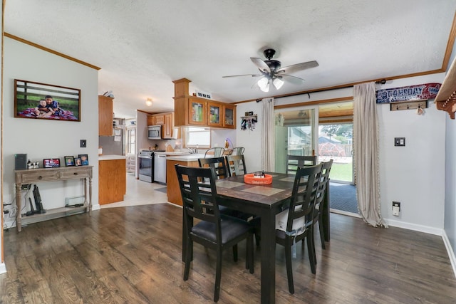 103 S Benson St, Lexington, IL 61753 - dining area with a textured ceiling, a ceiling fan, crown molding, and wood finished floors