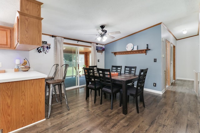 103 S Benson St, Lexington, IL 61753 - dining room featuring ornamental molding, dark wood finished floors, ceiling fan, and vaulted ceiling