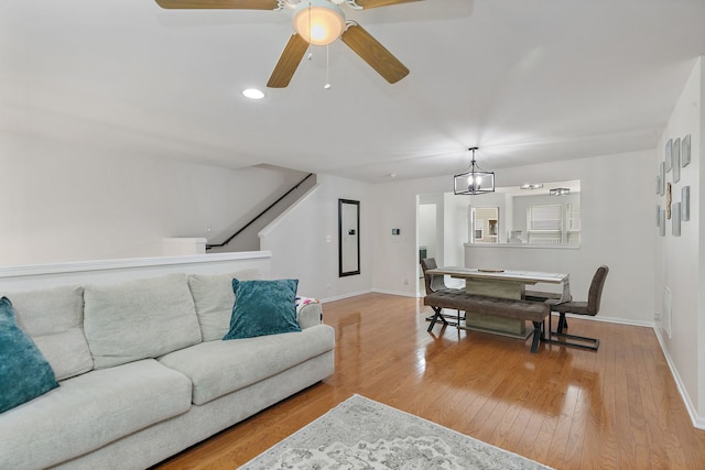 131 Bristol Ln Unit 2, Wood Dale, IL 60191 - living room with baseboards, light wood-style flooring, ceiling fan, stairway, and recessed lighting