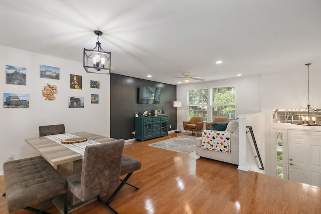 131 Bristol Ln Unit 2, Wood Dale, IL 60191 - dining area with a chandelier, hardwood / wood-style flooring, recessed lighting, ceiling fan, and baseboards