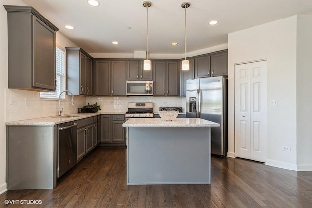 1425 N Charles Ave, Naperville, IL 60563 - kitchen with appliances with stainless steel finishes, a sink, dark wood-style floors, light stone counters, and recessed lighting