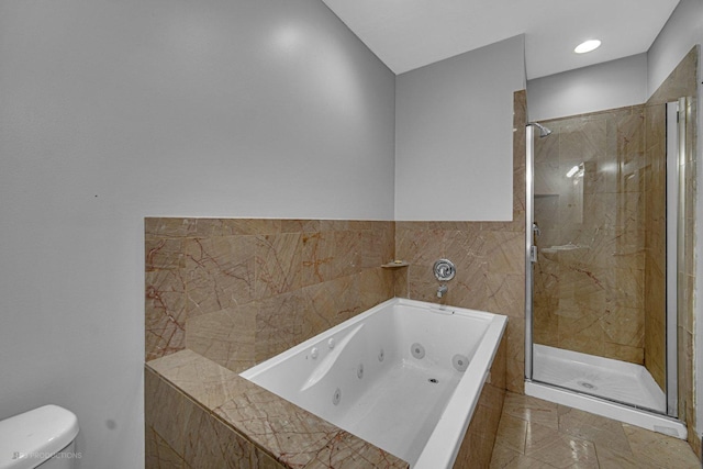 4829 S Prairie Ave Unit 2, Chicago, IL 60615 - full bathroom with a whirlpool tub, a stall shower, and toilet