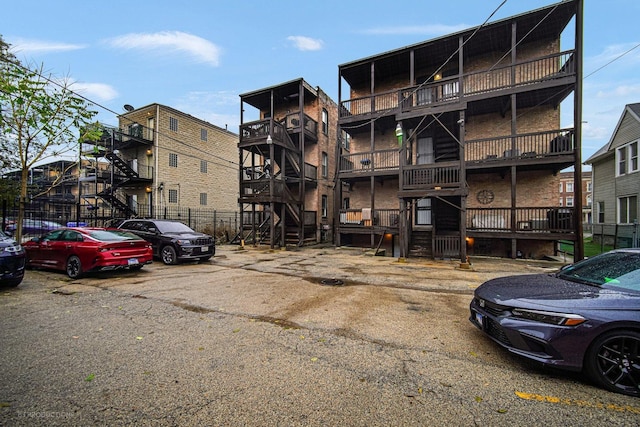 4829 S Prairie Ave Unit 2, Chicago, IL 60615 - view of apartment building / complex with uncovered parking and stairs