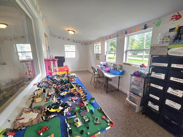 108 E Washington St, Ashkum, IL 60911 - playroom featuring carpet, baseboards, and cooling unit