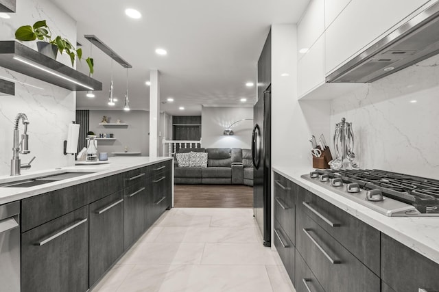 7215 Birchwood Ct Unit 19B, Willowbrook, IL 60527 - kitchen featuring custom range hood, a sink, stainless steel appliances, white cabinetry, and light marble finish flooring