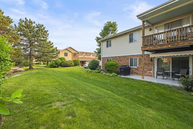 7215 Birchwood Ct Unit 19B, Willowbrook, IL 60527 - view of grassy yard with a balcony and a patio