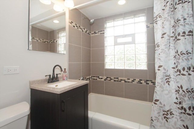 1711 White St, Des Plaines, IL 60018 - full bath featuring vanity, shower / tub combo with curtain, toilet, healthy amount of natural light, and recessed lighting