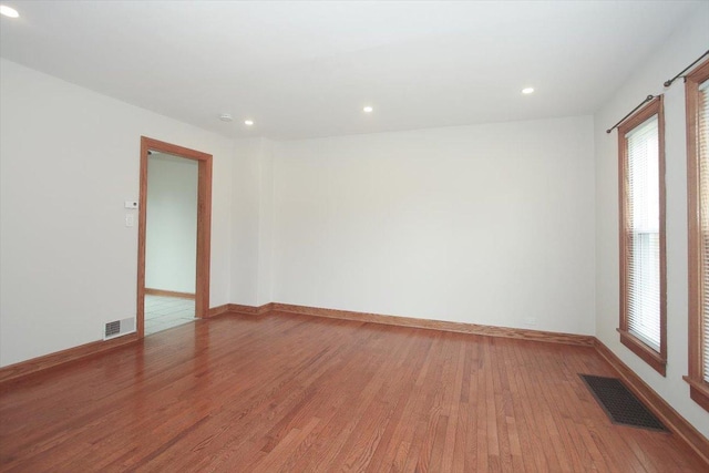 1711 White St, Des Plaines, IL 60018 - empty room featuring light wood finished floors, recessed lighting, and baseboards