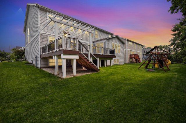 819 Heatherfield Cir, Naperville, IL 60565 - back of property with a pergola, a lawn, a playground, and stairs