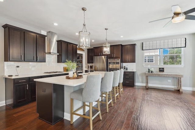 819 Heatherfield Cir, Naperville, IL 60565 - kitchen featuring wall chimney range hood, appliances with stainless steel finishes, light countertops, baseboards, and a ceiling fan