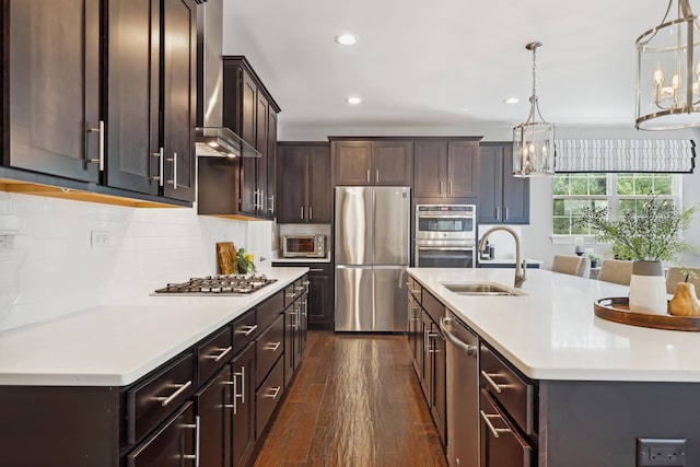 819 Heatherfield Cir, Naperville, IL 60565 - kitchen featuring stainless steel appliances, a sink, wall chimney range hood, recessed lighting, and dark brown cabinets