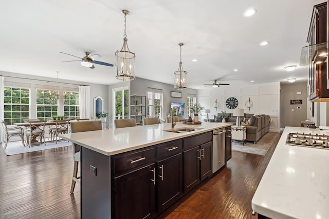 819 Heatherfield Cir, Naperville, IL 60565 - kitchen with ceiling fan, a sink, open floor plan, light countertops, and a kitchen breakfast bar