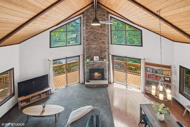 11214 Halma Ln, Woodstock, IL 60098 - living room with wooden ceiling, high vaulted ceiling, a stone fireplace, and wood-type flooring