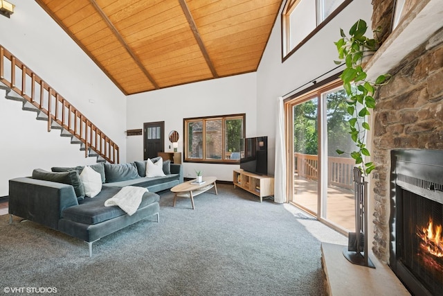 11214 Halma Ln, Woodstock, IL 60098 - carpeted living room featuring high vaulted ceiling, a lit fireplace, a wooden ceiling with exposed beams, and stairway