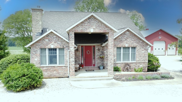 1897 N 2500 E Rd, Watseka, IL 60970 - view of front of home with brick siding, a chimney, and an outdoor structure