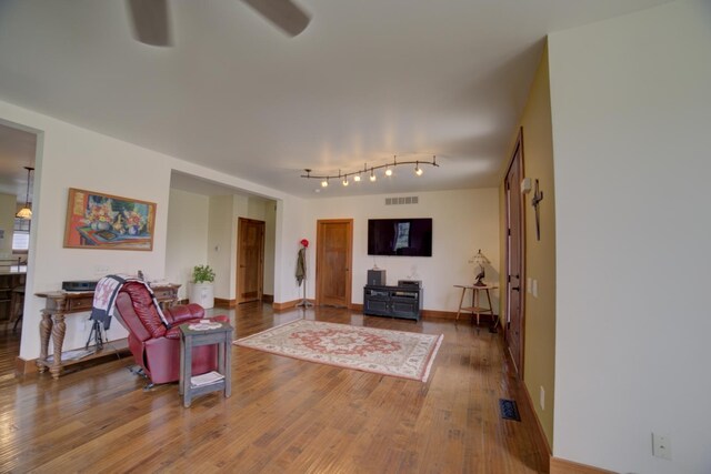 1897 N 2500 E Rd, Watseka, IL 60970 - living area with wood finished floors and a ceiling fan