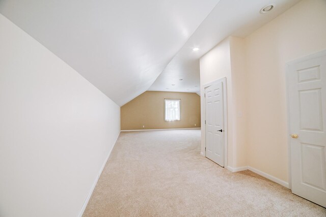 1897 N 2500 E Rd, Watseka, IL 60970 - additional living space with light colored carpet, lofted ceiling, and recessed lighting