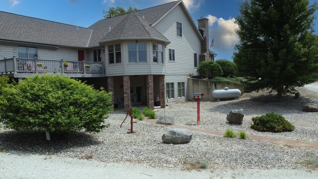 1897 N 2500 E Rd, Watseka, IL 60970 - view of front of home featuring a chimney and brick siding