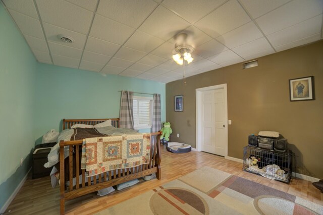 1897 N 2500 E Rd, Watseka, IL 60970 - bedroom featuring wood finished floors, a paneled ceiling, and ceiling fan