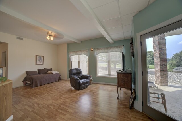 1897 N 2500 E Rd, Watseka, IL 60970 - bedroom with wood finished floors, beam ceiling, access to exterior, and a ceiling fan