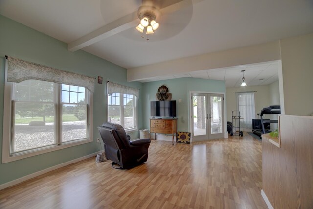 1897 N 2500 E Rd, Watseka, IL 60970 - living area with light wood-style floors, french doors, ceiling fan, and beam ceiling