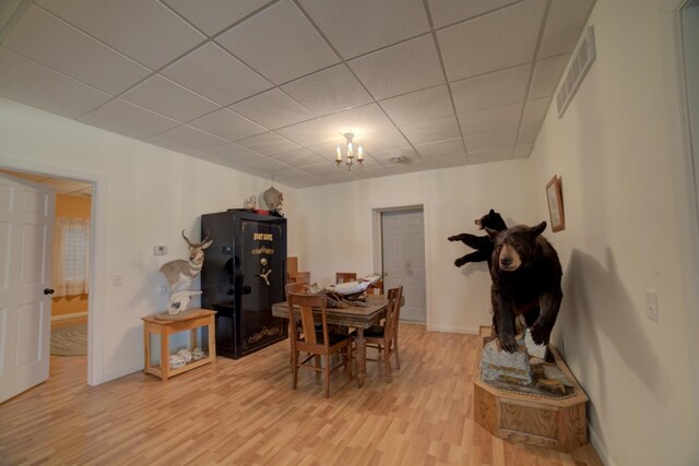 1897 N 2500 E Rd, Watseka, IL 60970 - dining room with light wood finished floors, a paneled ceiling, and a chandelier