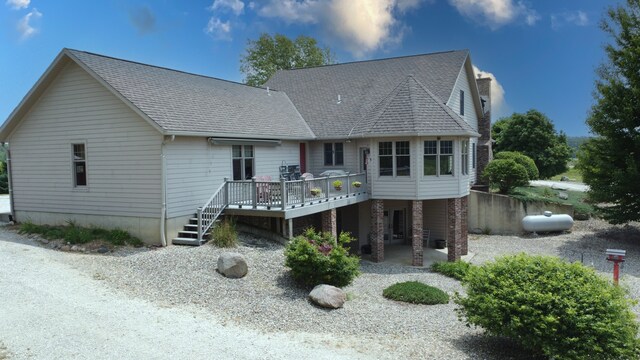 1897 N 2500 E Rd, Watseka, IL 60970 - view of front of property with a deck, a shingled roof, and a patio area