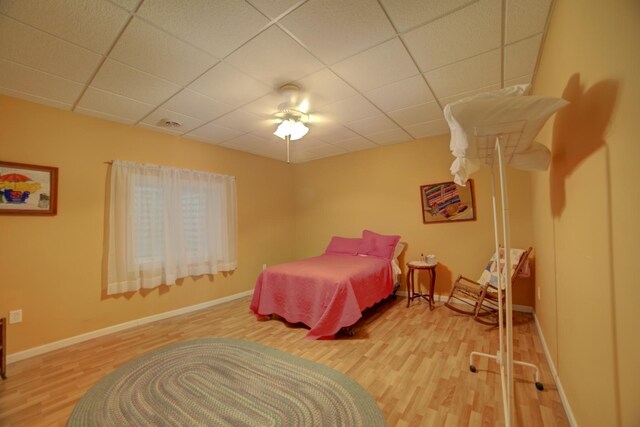 1897 N 2500 E Rd, Watseka, IL 60970 - bedroom with wood finished floors, a paneled ceiling, and a ceiling fan