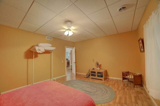 1897 N 2500 E Rd, Watseka, IL 60970 - bedroom featuring light wood-style floors, a paneled ceiling, and ceiling fan