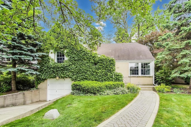 433 S Dunton Ave, Arlington Heights, IL 60005 - view of front of home with a front yard, concrete driveway, and a garage