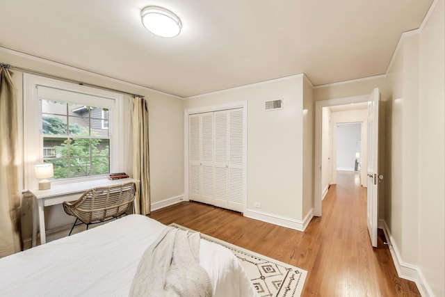 433 S Dunton Ave, Arlington Heights, IL 60005 - bedroom featuring wood finished floors, baseboards, a closet, and ornamental molding
