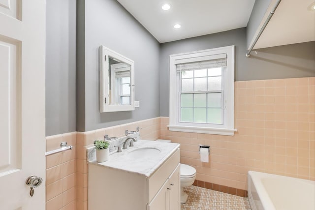 433 S Dunton Ave, Arlington Heights, IL 60005 - full bath featuring tile walls, toilet, tile patterned floors, vanity, and a tub