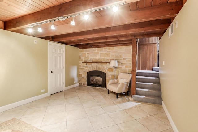 433 S Dunton Ave, Arlington Heights, IL 60005 - living area featuring wood ceiling with exposed beams, track lighting, tile patterned flooring, stairs, and a stone fireplace