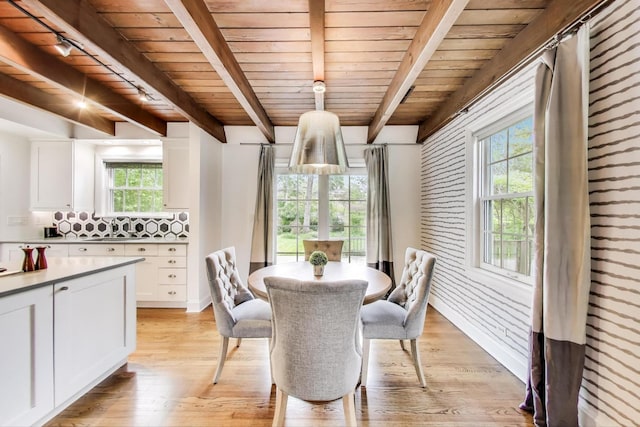 433 S Dunton Ave, Arlington Heights, IL 60005 - dining area featuring wooden ceiling with exposed beams, light wood-style floors, and baseboards