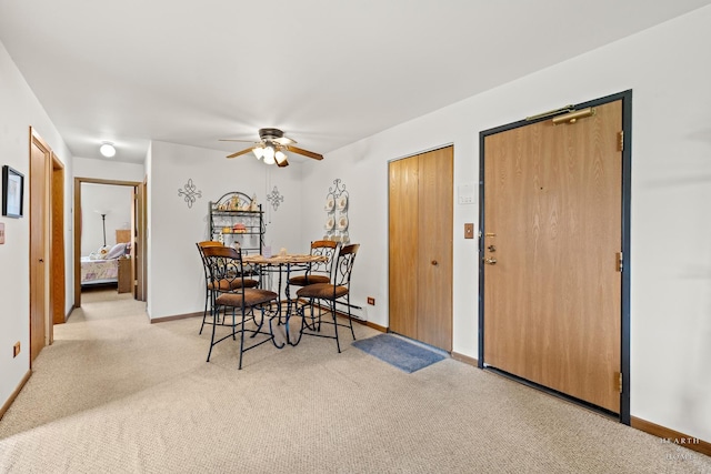 417 Berkshire Dr Unit 16, Crystal Lake, IL 60014 - dining area with light carpet, a ceiling fan, and baseboards