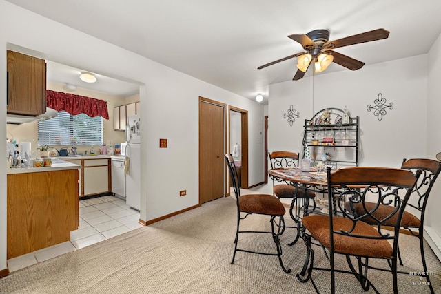 417 Berkshire Dr Unit 16, Crystal Lake, IL 60014 - dining area featuring a ceiling fan, baseboards, and light tile patterned floors