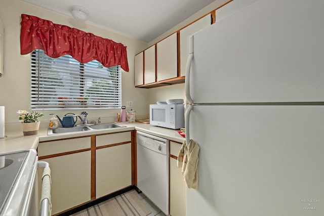 417 Berkshire Dr Unit 16, Crystal Lake, IL 60014 - kitchen with white appliances, light countertops, and a sink