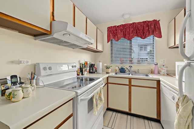 417 Berkshire Dr Unit 16, Crystal Lake, IL 60014 - kitchen featuring white appliances, exhaust hood, a sink, and light countertops