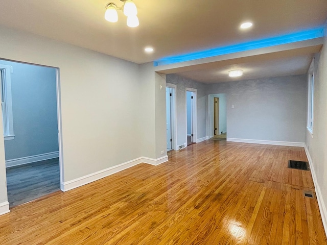 3106 S May St, Chicago, IL 60608 - unfurnished room featuring wood finished floors, baseboards, recessed lighting, and a chandelier